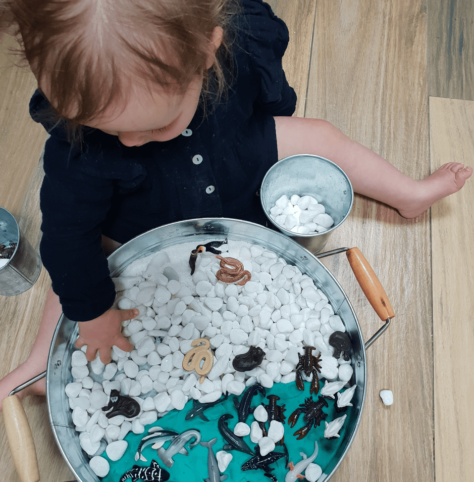 Toddler Playing with Yowie Winter Sensory Activity Bin